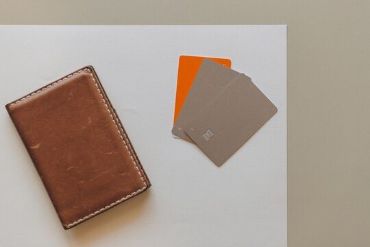 Leather Wallet with Credit Cards and Bank Cards Flat Lay on Desk Surface