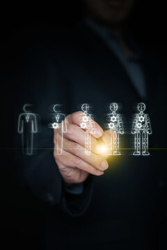 Hand holding stylus drawing progression from human worker to full robot. Artificial intelligence disruption, workforce automation, AI technological evolution, industrial transformation. Vertical photo