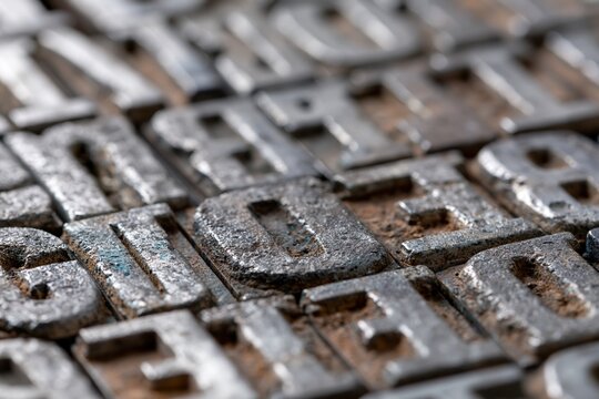 The Weathered Letterpress Blocks Closeup of Industrial Metallic Type and Texture