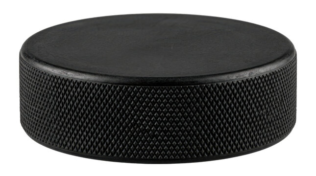 Solid black vulcanized rubber hockey puck with a flat cylindrical shape and textured knurled edges. Photorealistic, top 3/4 view, square orientation, ultra-high-resolution 8K, on a pure white