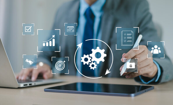 Business professionals are developing digital automation systems and optimizing workflows using AI to enhance operational efficiency, business technology, and digital transformation strategies.