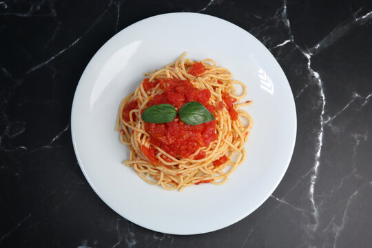 spaghetti pasta with tomato sauce and basil