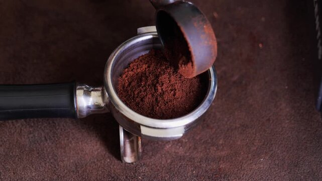 Pouring Ground Coffee into Portafilter Close-Up
