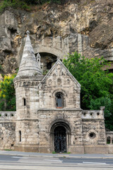 Stone gable and turret of the Pauline cave monastery chapel against Gellert Hill rock in Budapest, Hungary © Guillaume Angleraud