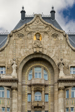Art Nouveau gable of Gresham Palace with a portrait medallion and gilded ornament in central Budapest