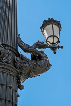 Winged dragon bracket supporting a lamp on an ornate cast-iron column of Margaret Bridge over the Danube in Budapest