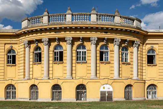 Symmetrical colonnade of the Sz&eacute;chenyi bath house facade seen under a bright summer sky in Budapest, Hungary