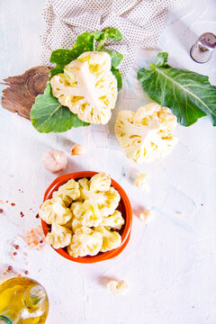 Head of cauliflower sits on a light table