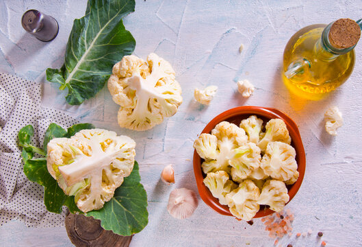 Head of cauliflower sits on a light table