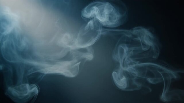 Abstract Blue Smoke Wisps Against Dark Background