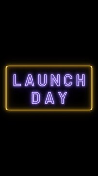 Neon launch day sign flickering on a black background for product announcement and business marketing.