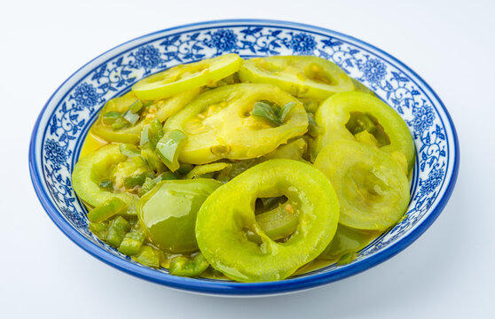 A plate of stir-fried green tomatoes
