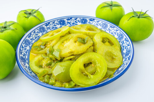 A plate of stir-fried green tomatoes
