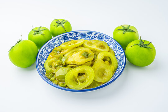A plate of stir-fried green tomatoes