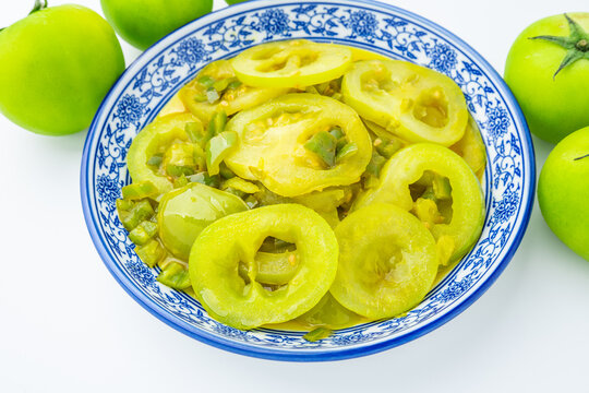 A plate of stir-fried green tomatoes