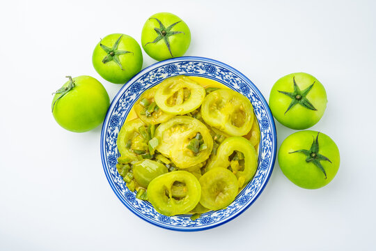 A plate of stir-fried green tomatoes