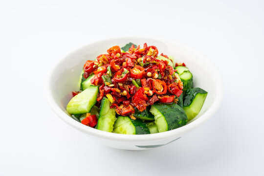 A plate of cold cucumber salad with a sour and spicy dressing