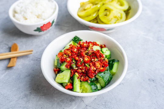 Chinese-style vegetarian weight-loss meal: Smashed cucumber salad and stir-fried green tomatoes with rice.