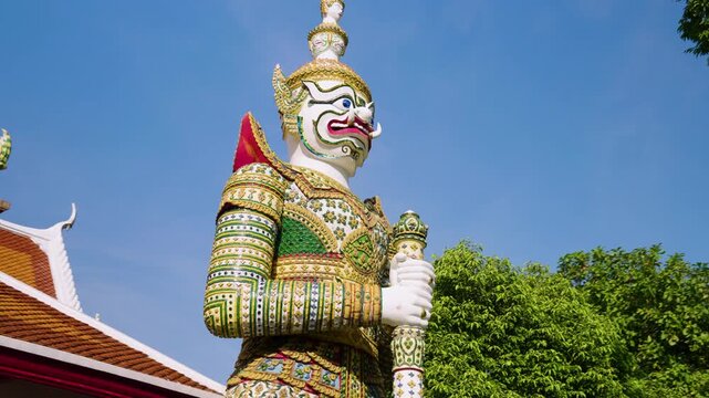 Guardian Demon Statue (Yaksha) Outside The Ordination Hall At Wat Arun In Bangkok, Thailand. - low angle shot