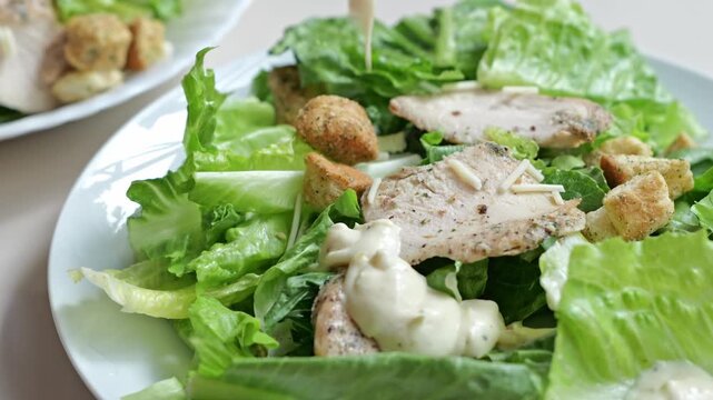 Romaine Lettuce Salad with Grilled Chicken and Creamy Caesar Dressing Served Freshly
