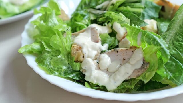 Chicken Caesar Salad With Grilled Chicken, Lettuce, Creamy Dressing and Fresh Greens