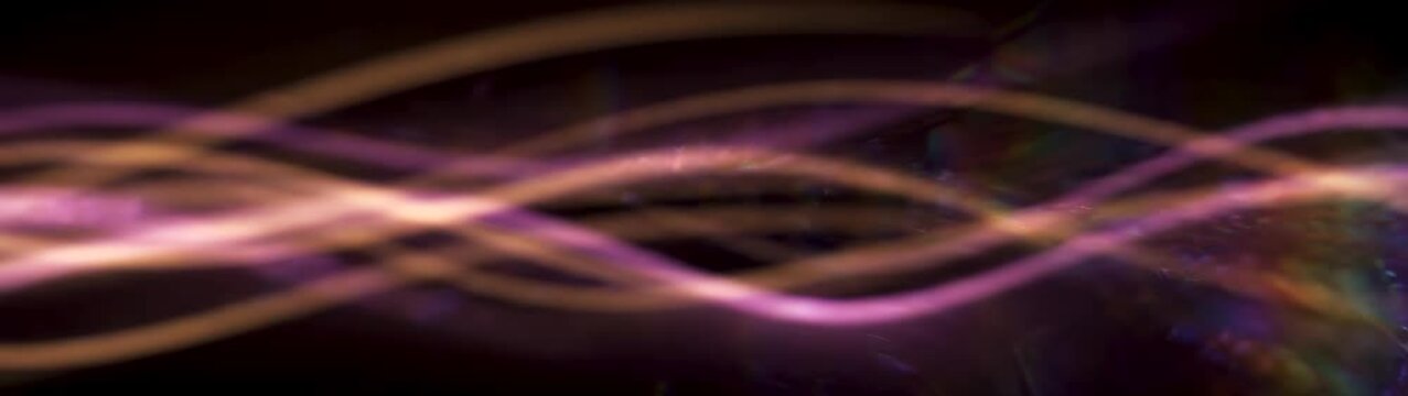 Data flow and digital connectivity concept abstract light streaks moving across dark background high speed fiber optic communication and network technology.