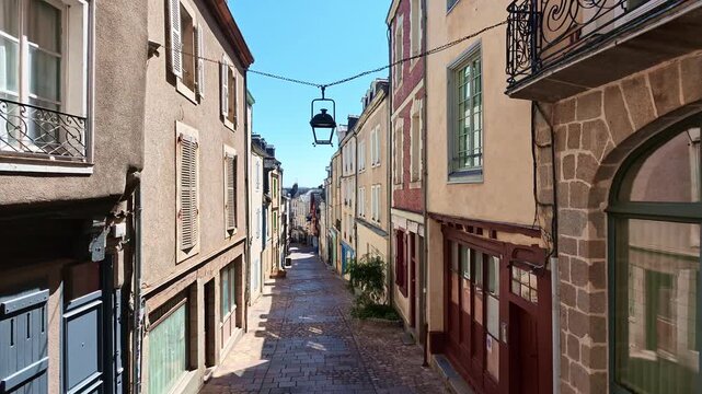 Grande Rue with its traditional architecture, colorful facades, and cobblestone street in Laval, France