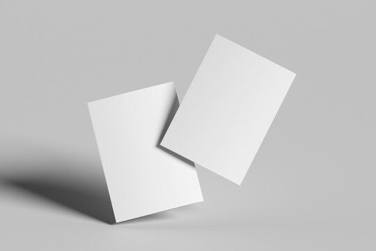 two blank bifold brochure mockup covers on grey background	