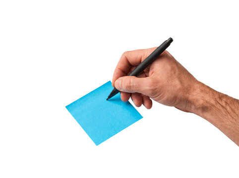 Caucasian man writing on blue sticky note top view