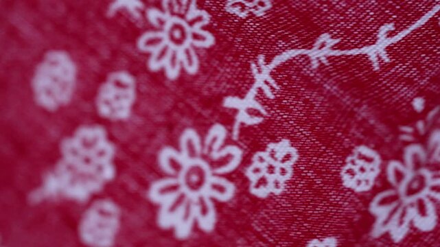 Red fabric texture with white floral pattern background