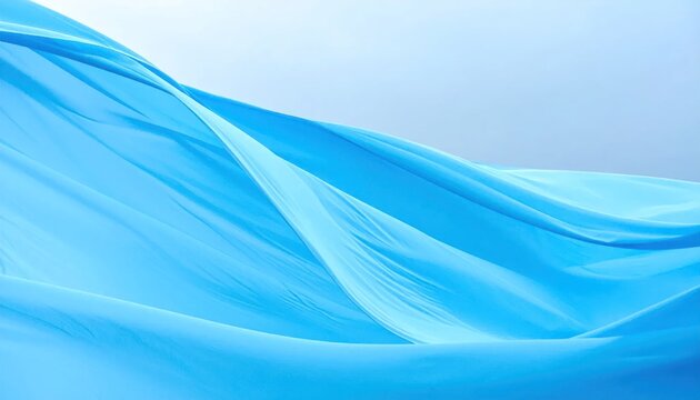 Flowing light blue fabric ripples in soft airy waves