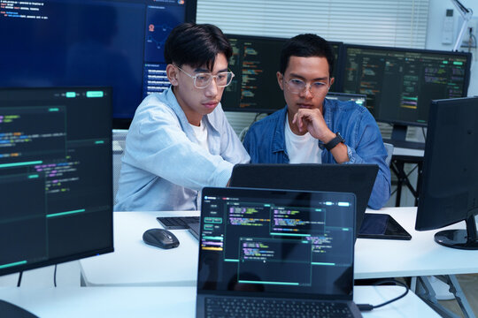 Programmers Collaborating on Software Development and AI Code