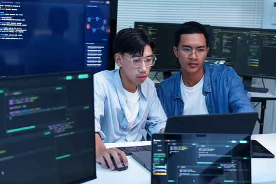 Programmers Developing Digital Software with Code and AI Technology