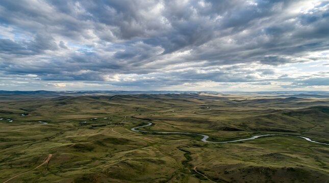 Mongolia steppe aerial, endless grassland, dramatic sky, no text no people