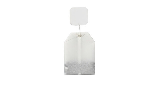 One single paper herbal tea bag isolated on transparent background