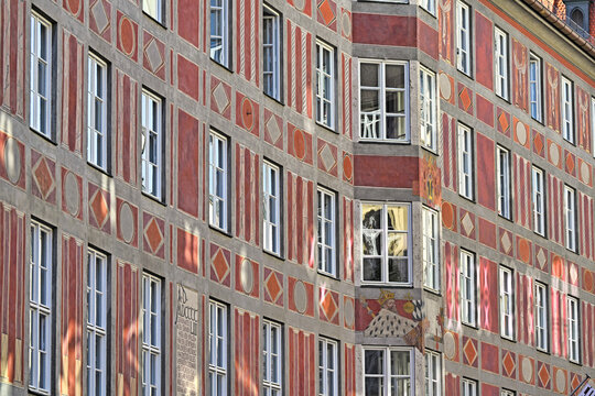 Close up of historic painted facade of building with sgraffito patterns in Munich, Germany
