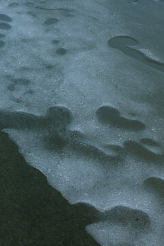 Top view of abstract organic textures formed by water and sand ripples