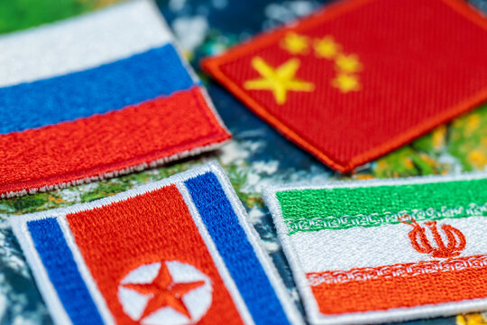 Symbols of Russia, China, North Korea, and Iran set against the backdrop of the world &ndash; the concept of an alliance and cooperation among multipolar states.