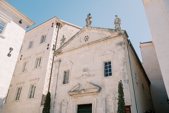 St. Mark's Church facade with statues and blue sky