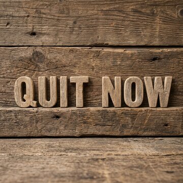 Quit Now Word Art On Rustic Wood Background