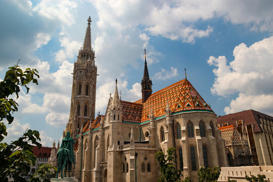 Matthias Church and Gothic steeple architecture under a blue sky in Buda Castle Budapest Hungary