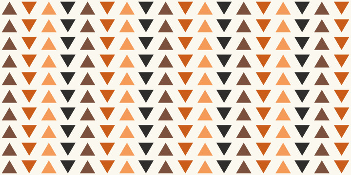 Halloween seamless background with repeating orange, brown, and black triangles on white, creating a festive geometric pattern for seasonal designs, textiles, packaging, and party decor.
