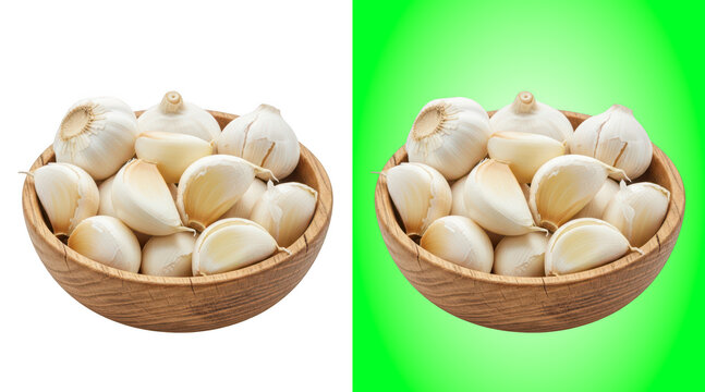 Fresh garlic bulbs in wooden bowls on green background