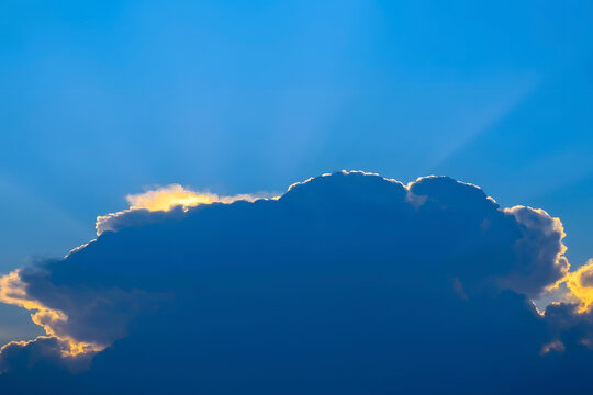sunlit cloud rim light blue sky