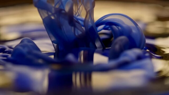 Swirl of Blue Liquid Mixing in Clear Water