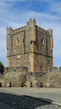 exploring ancient stone castle keep tower with battlements concept of medieval history travel tourism European fortress cultural heritage blue sky copy space above