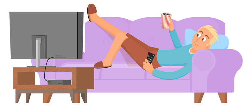 Home rest. Young man lay on couch and watch tv