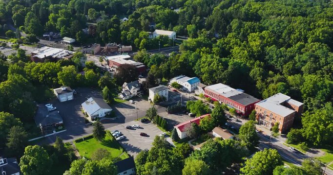Trumansburg, NY, USA - August 21, 2026 - Afternoon aerial video, panning, of the village of Trumansburg on a sunny summer day, 4096 x 2160, Frame rate 29.97 fps.