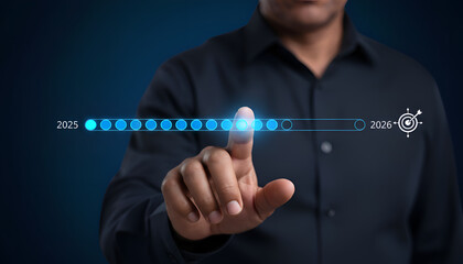 Obraz premium Businessman interacting with a digital progress bar interface representing the transition from year 2025 to 2026