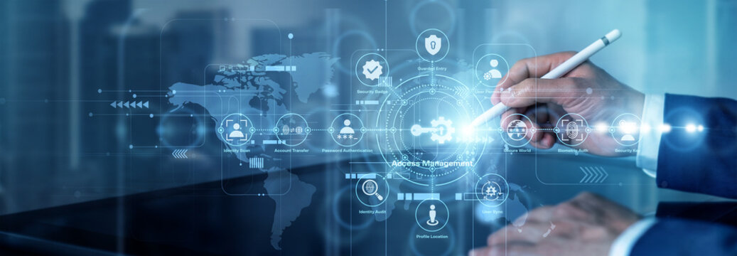 An IT administrator points at a network screen showing user identities, permission levels, and secure login nodes. Access Management controls who can enter systems and view protected resources.